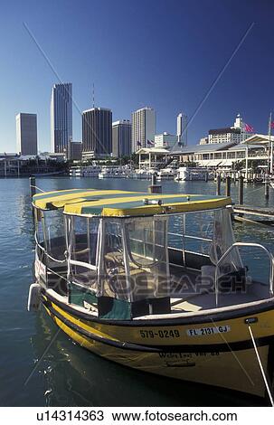 water taxi, Miami, FL, skyline, Florida, Atlantic Ocean, Yellow water taxi docked outside Bayside Marketplace, a shopping, dining, entertainment mecca, on Biscayne Bay and skyline of downtown Miami. View Large Photo Image Stock Image - water taxi, Miami, FL, skyline, Florida, Atlantic Ocean, Yellow water taxi docked outside Bayside Marketplace, a shopping, dining, entertainment mecca, on Biscayne Bay and skyline of downtown Miami.. Fotosearch