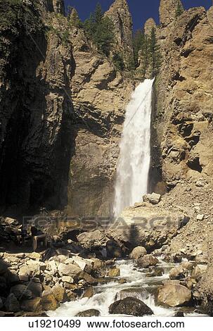 waterfalls, Yellowstone National Park, WY, Tower Junction, Yellowstone River, Tower Falls, Wyoming, Scenic view of Tower Falls cascading down the Yellowstone Canyon in Yellowstone Nat'l Park in Wyoming. The Grand Canyon of Yellowstone. View Large Photo Image Stock Photo - waterfalls, Yellowstone National Park, WY, Tower Junction, Yellowstone River, Tower Falls, Wyoming, Scenic view of Tower Falls cascading down the Yellowstone Canyon in Yellowstone Nat'l Park in Wyoming. The Grand Canyon of Yellowstone.. Fotosearch