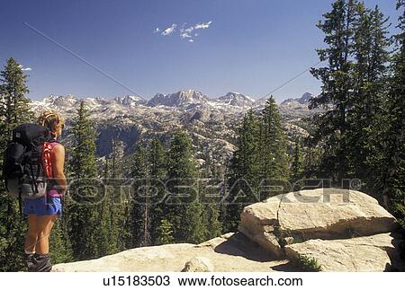 Wind River Range, woman hiker, Bridger-Teton National Forest, WY, hiking, Wyoming, Woman with backpack looking at the scenic view of the Wind River Range Mountains in the Bridger-Teton Nat'l Forest in Wyoming. View Large Photo Image Stock Image - Wind River Range, woman hiker, Bridger-Teton National Forest, WY, hiking, Wyoming, Woman with backpack looking at the scenic view of the Wind River Range Mountains in the Bridger-Teton Nat'l Forest in Wyoming.. Fotosearch