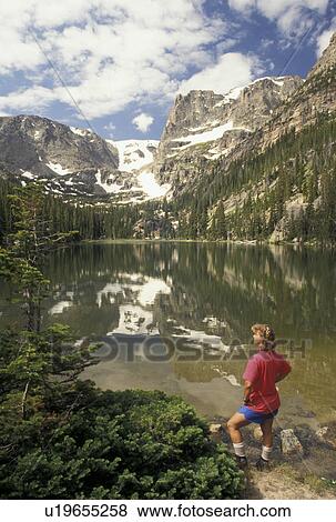 woman hiking, Rocky Mountain National Park, CO, Colorado, Woman looking at the scenic view of Odessa Lake and surrounding mountains in Rocky Mountain Nat'l Park. View Large Photo Image Stock Photo - woman hiking, Rocky Mountain National Park, CO, Colorado, Woman looking at the scenic view of Odessa Lake and surrounding mountains in Rocky Mountain Nat'l Park.. Fotosearch