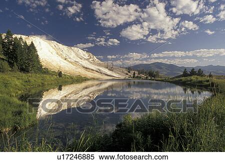 Yellowstone National Park, Mammoth Hot Springs, WY, Wyoming, Canary Springs reflect in the calm waters of a pond at Mammoth Hot Springs in Yellowstone Nat'l Park in Wyoming. View Large Photo Image Stock Photography - Yellowstone National Park, Mammoth Hot Springs, WY, Wyoming, Canary Springs reflect in the calm waters of a pond at Mammoth Hot Springs in Yellowstone Nat'l Park in Wyoming. . Fotosearch