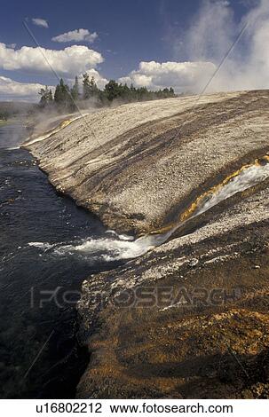 Stock Image -  Yellowstone National Park, WY, Wyoming, Run off from hot springs drain into Iron Creek at Biscuit Basin in Yellowstone Nat'l Park in Wyoming.. Fotosearch