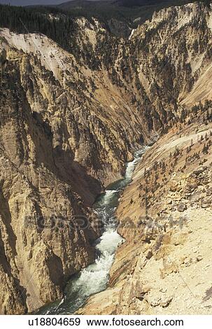 Stock Photo -  Yellowstone River, Yellowstone National Park, WY, Canyon Village, Wyoming, Scenic view of the Yellowstone River flowing through Yellowstone Canyon from Inspiration Point in Yellowstone Nat'l Park in Wyoming. The Grand Canyon of Yellowstone. . Fotosearch