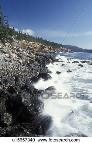 Stock Image -  Acadia National Park, ME, Maine, Mount Desert Island, Waves splash against the rocky coastline in Acadia Nat'l Park on the Atlantic Ocean. . Fotosearch
