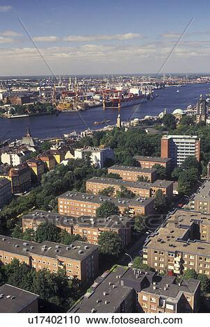 Stock Image -  aerial, Hamburg, Germany, Elbe River, Europe, Aerial view of Port of Hamburg along the Elbe River.. Fotosearch