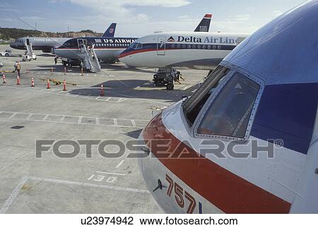 airport, St. Thomas, U. S. Virgin Islands, Caribbean, USVI, Commercial Airline Jets parked at the gate at Cycil E. King Airport terminal on Saint Thomas Island. View Large Photo Image Stock Image - airport, St. Thomas, U. S. Virgin Islands, Caribbean, USVI, Commercial Airline Jets parked at the gate at Cycil E. King Airport terminal on Saint Thomas Island.. Fotosearch