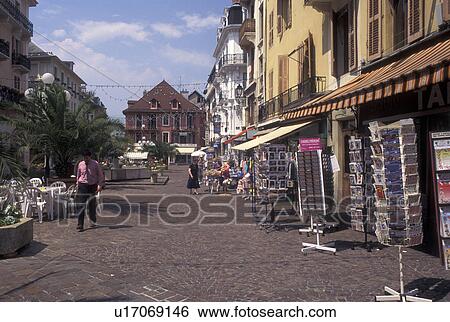 Aix-Les-Bains, France, Savoie, Rhone-Alpes, Europe, Postcard racks outside shops along a narrow cobbled pedestrian street in the spa resort town of Aix-les-Bains. View Large Photo Image Stock Photograph - Aix-Les-Bains, France, Savoie, Rhone-Alpes, Europe, Postcard racks outside shops along a narrow cobbled pedestrian street in the spa resort town of Aix-les-Bains.. Fotosearch