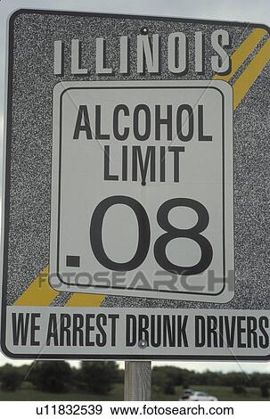 Stock Photo -  Alcohol Limit 0. 08 we arrest drunk drivers warning sign on the highway. IL, Illinois. Fotosearch