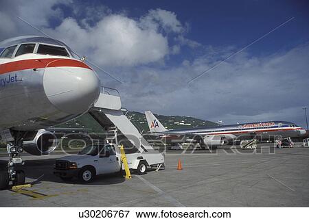 American Airlines, St. Thomas, U. S. Virgin Islands, Caribbean, USVI, American Airlines Jet parked at the gate at Cycil E. King Airport terminal on Saint Thomas Island. View Large Photo Image Stock Photo - American Airlines, St. Thomas, U. S. Virgin Islands, Caribbean, USVI, American Airlines Jet parked at the gate at Cycil E. King Airport terminal on Saint Thomas Island.. Fotosearch
