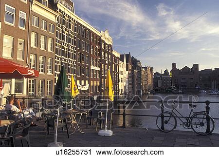 Amsterdam, Netherlands, Holland, Noord-Holland, Europe, Buildings along a canal in Amsterdam. View Large Photo Image Stock Image - Amsterdam, Netherlands, Holland, Noord-Holland, Europe, Buildings along a canal in Amsterdam.. Fotosearch