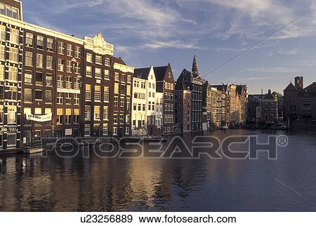Amsterdam, Netherlands, Holland, Noord-Holland, Europe, Buildings along a canal in Amsterdam. View Large Photo Image Stock Photo - Amsterdam, Netherlands, Holland, Noord-Holland, Europe, Buildings along a canal in Amsterdam.. Fotosearch