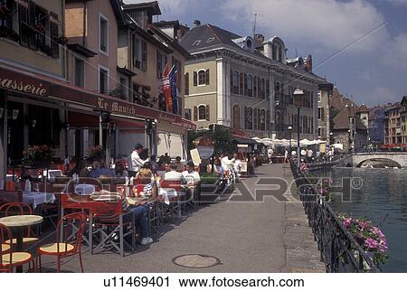 Stock Image -  Annecy, outdoor cafT, France, Haute-Savoie, Rhone-Alpes, Europe, Outdoor cafes along the Thiou canal in the old town of Annecy. . Fotosearch