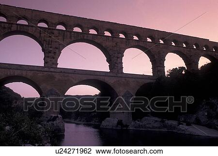 aqueduct, France, Pont du Gard, Languedoc-Roussillon, Europe, Three-tiered 19 BC Roman Aqueduct, Pont du Gard spans the Gardon River. View Large Photo Image Stock Image - aqueduct, France, Pont du Gard, Languedoc-Roussillon, Europe, Three-tiered 19 BC Roman Aqueduct, Pont du Gard spans the Gardon River.. Fotosearch