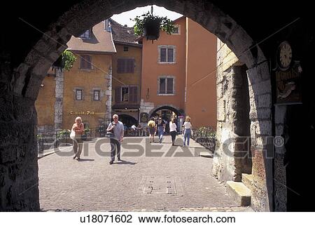 Stock Image -  arch, France, Annecy, Haute-Savoie, Rhone-Alpes, Europe, Archway along a narrow pedestrian street in the old town of Annecy. . Fotosearch