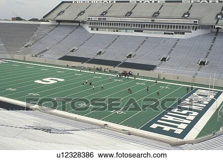 arena, East Lansing, MI, Michigan, MSU, Football team practicing at Spartans Football Stadium on the campus of Michigan State University. View Large Photo Image Stock Photograph - arena, East Lansing, MI, Michigan, MSU, Football team practicing at Spartans Football Stadium on the campus of Michigan State University.. Fotosearch