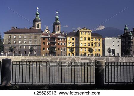 Stock Image -  Austria, Innsbruck, Tirol, St. Jacob's Cathedral and buildings along the Inn River in the city of Innsbruck.. Fotosearch