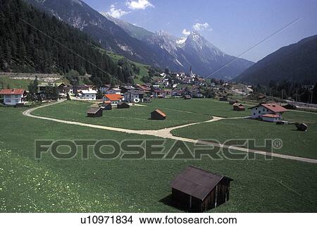 Austria, Tirol, Strengen, Picturesque view of the scenic village of Strengen and the Austrian Alps. View Large Photo Image Picture - Austria, Tirol, Strengen, Picturesque view of the scenic village of Strengen and the Austrian Alps.. Fotosearch