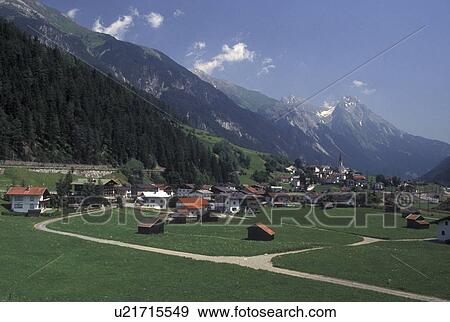 Stock Photo -  Austria, Tirol, Strengen, Picturesque view of the scenic village of Strengen and the Austrian Alps.. Fotosearch