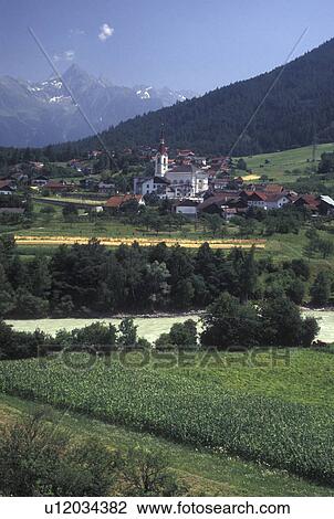 Austria, Tirol, Zamas, Picturesque view of the scenic village of Zamas and the Austrian Alps. View Large Photo Image Stock Image - Austria, Tirol, Zamas, Picturesque view of the scenic village of Zamas and the Austrian Alps.. Fotosearch
