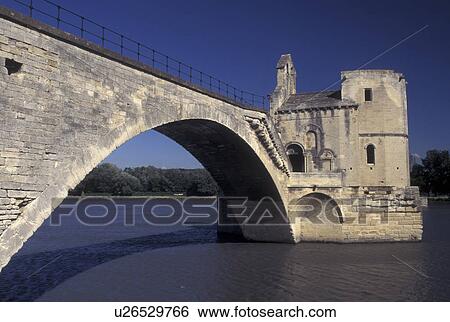 Stock Photograph -  Avignon, France, Provence, Vaucluse, Europe, 12th century Pont St-Benezet on the Rhone River in Avignon. A popular old children's song was named after the bridge 'sur le pont d'Avignon'.. Fotosearch