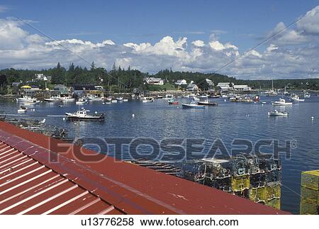 Bass Harbor, ME, Maine, Mount Desert Island, View of lobster fishing boats buoyed in the harbor in the fishing village of Bass Harbor on the Atlantic Ocean. View Large Photo Image Stock Photo - Bass Harbor, ME, Maine, Mount Desert Island, View of lobster fishing boats buoyed in the harbor in the fishing village of Bass Harbor on the Atlantic Ocean.. Fotosearch