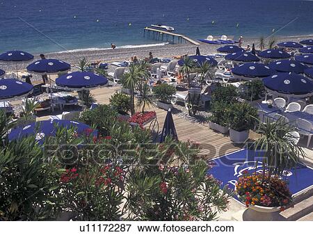 beach, France, Nice, Cote d' Azur, Provence, Alpes-Maritimes, Europe, A view of the beach along the Mediterranean Sea in the city of Nice. View Large Photo Image Stock Photo - beach, France, Nice, Cote d' Azur, Provence, Alpes-Maritimes, Europe, A view of the beach along the Mediterranean Sea in the city of Nice.. Fotosearch