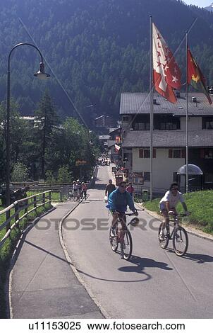 biking, Zermatt, Switzerland, Valais, Alps, Biking through the mountain resort village of Zermatt in the Swiss Alps. View Large Photo Image Stock Photography - biking, Zermatt, Switzerland, Valais, Alps, Biking through the mountain resort village of Zermatt in the Swiss Alps.. Fotosearch