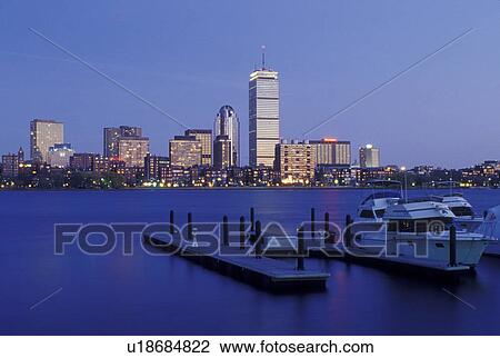 Stock Image -  Boston, skyline, MA, Massachusetts, The Prudential Tower and skyline of downtown Boston from a marina on the Charles River in the evening.. Fotosearch