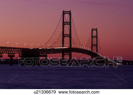bridge, Mackinaw City, MI, Michigan, Upper Peninsula, View of Mackinac Bridge, a suspension span bridge, in the evening crosses the Straits of Mackinaw in Mackinaw City connecting the Lower Peninsula with the Upper Peninsula of Michigan. View Large Photo Image Stock Photo -  bridge, Mackinaw City, MI, Michigan, Upper Peninsula, View of Mackinac Bridge, a suspension span bridge, in the evening crosses the Straits of Mackinaw in Mackinaw City connecting the Lower Peninsula with the Upper Peninsula of Michigan.. Fotosearch