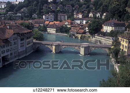 bridge, Switzerland, Berne, Bern, Aare River, Scenic view of The Untertorbrucke, Bern's oldest bridge, crossing the Aare River. View Large Photo Image Stock Image - bridge, Switzerland, Berne, Bern, Aare River, Scenic view of The Untertorbrucke, Bern's oldest bridge, crossing the Aare River.. Fotosearch
