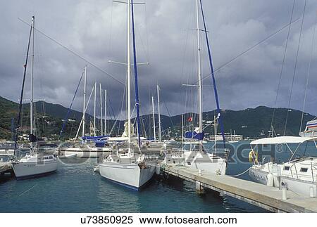 Stock Photography -  British Virgin Islands, Tortola, Road Town, Caribbean, BVI, Boats docked at a yacht club on the Caribbean Sea on the island of Tortola.. Fotosearch