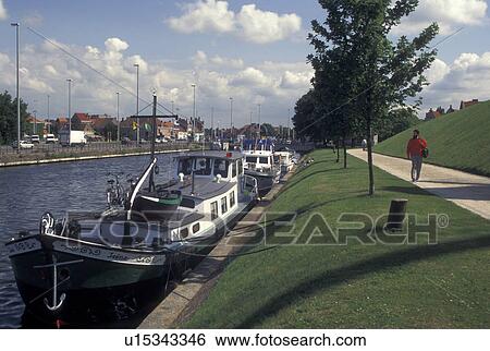 Bruges, Brugge, Belgium, West-Vlaanderen, Europe, Barges docked along a canal in Brugge. View Large Photo Image Stock Photograph - Bruges, Brugge, Belgium, West-Vlaanderen, Europe, Barges docked along a canal in Brugge.. Fotosearch