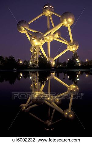 Brussels, Bruxelles, Belgium, Europe, Reflection of The Atomium, symbol of the 1958 World's Fair, a monument composed of nine giant metal spheres that represent the atoms of an iron molecule, in the water in the evening. View Large Photo Image Stock Image - Brussels, Bruxelles, Belgium, Europe, Reflection of The Atomium, symbol of the 1958 World's Fair, a monument composed of nine giant metal spheres that represent the atoms of an iron molecule, in the water in the evening.. Fotosearch
