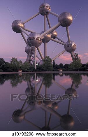 Brussels, Bruxelles, Belgium, Europe, Reflection of The Atomium, symbol of the 1958 World's Fair, a monument composed of nine giant metal spheres that represent the atoms of an iron molecule, in the water in the evening. View Large Photo Image Stock Photo - Brussels, Bruxelles, Belgium, Europe, Reflection of The Atomium, symbol of the 1958 World's Fair, a monument composed of nine giant metal spheres that represent the atoms of an iron molecule, in the water in the evening.. Fotosearch