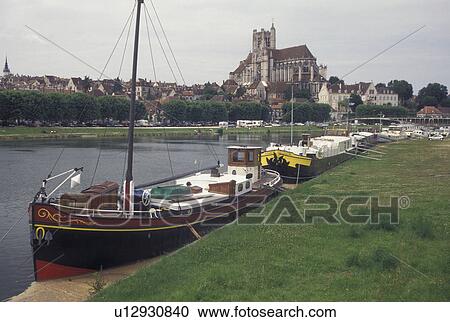 Burgundy, France, Auxerre, Yonne, wine region, Bourgogne, Europe, Scenic view of the Ste-Etienne cathedral and the barges along the Yonne River in the city of Auxerre in the wine region of Burgundy. View Large Photo Image Stock Image - Burgundy, France, Auxerre, Yonne, wine region, Bourgogne, Europe, Scenic view of the Ste-Etienne cathedral and the barges along the Yonne River in the city of Auxerre in the wine region of Burgundy.. Fotosearch
