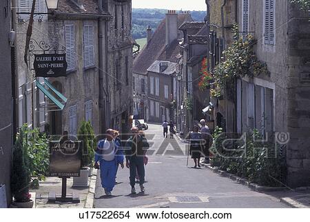Burgundy, France, Vezelay, Yonne, wine region, Bourgogne, Europe, Shops along a narrow street in Vezelay in the wine region of Burgundy. View Large Photo Image Picture - Burgundy, France, Vezelay, Yonne, wine region, Bourgogne, Europe, Shops along a narrow street in Vezelay in the wine region of Burgundy.. Fotosearch