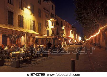 cafT, France, Antibes, Cote d' Azur, Provence, Alpes-Maritimes, Europe, Outdoor cafT along the streets of Antibes in the evening. View Large Photo Image Stock Photo - cafT, France, Antibes, Cote d' Azur, Provence, Alpes-Maritimes, Europe, Outdoor cafT along the streets of Antibes in the evening.. Fotosearch