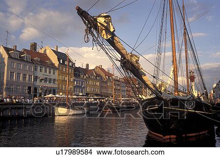 Picture -  canal, Copenhagen, Denmark, Scandinavia, Sjaelland, Europe, Boats docked along Nyhavn (New Harbor) in the scenic city of Copenhagen. Fotosearch