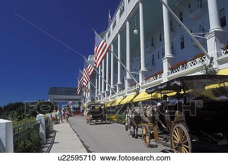 carriage tours, Grand Hotel, Mackinac Island, MI, Lake Huron, Michigan, Carriage rides in front of the Historic Grand Hotel on Mackinac Island. View Large Photo Image Stock Image - carriage tours, Grand Hotel, Mackinac Island, MI, Lake Huron, Michigan, Carriage rides in front of the Historic Grand Hotel on Mackinac Island.. Fotosearch