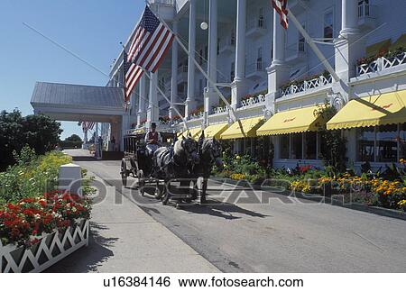 carriage tours, Grand Hotel, Mackinac Island, MI, Lake Huron, Michigan, Carriage ride in front of the Historic Grand Hotel on Mackinac Island. View Large Photo Image Stock Photograph - carriage tours, Grand Hotel, Mackinac Island, MI, Lake Huron, Michigan, Carriage ride in front of the Historic Grand Hotel on Mackinac Island.. Fotosearch