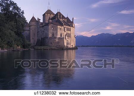 chateau, Chateau de Chillon, Switzerland, Alps, Lake Geneva, Montreux, Vaud, Scenic view of Chateau de Chillon an 13th century fortress surrounded by the Alps along the lakeshore of Lac Leman in the Canton of Vaud. View Large Photo Image Stock Image - chateau, Chateau de Chillon, Switzerland, Alps, Lake Geneva, Montreux, Vaud, Scenic view of Chateau de Chillon an 13th century fortress surrounded by the Alps along the lakeshore of Lac Leman in the Canton of Vaud. . Fotosearch