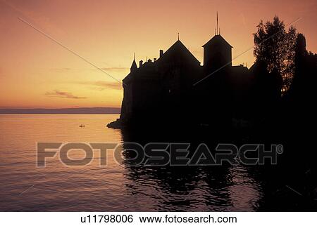 Chateau de Chillon, Switzerland, chateau, sunset, Vaud, Montreux, Lake Geneva, Silhouette of Chateau de Chillon an 13th century fortress at sunset along the lakeshore of Lac Leman in the Canton of Vaud. View Large Photo Image Stock Photograph - Chateau de Chillon, Switzerland, chateau, sunset, Vaud, Montreux, Lake Geneva, Silhouette of Chateau de Chillon an 13th century fortress at sunset along the lakeshore of Lac Leman in the Canton of Vaud. . Fotosearch