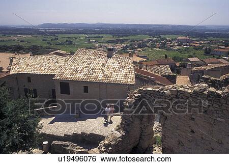 Stock Photograph -  Chateau-Neuf-du-Pape, France, Provence, Vaucluse, Europe, Scenic view of the roof tops and village of Chateau-Neuf-du-Pape in Provence.. Fotosearch