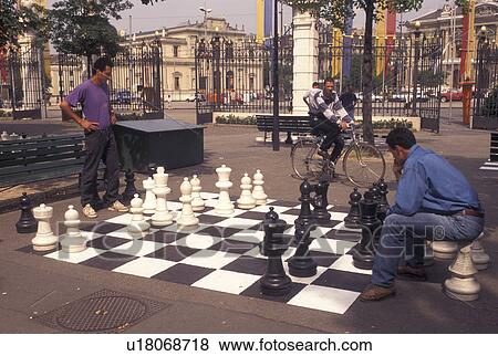 chess, game, Geneva, Switzerland, Men playing a game of chess on a giant chessboard at the Promenade des Bastions in the city of Geneva. View Large Photo Image Stock Photo - chess, game, Geneva, Switzerland, Men playing a game of chess on a giant chessboard at the Promenade des Bastions in the city of Geneva.. Fotosearch