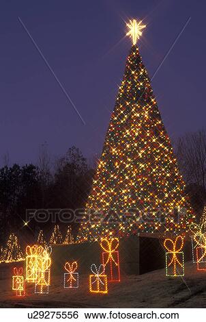 Stock Photograph -  Christmas decoration, Marietta, GA, Georgia, Atlanta, Lights of Life Christmas light display of Christmas tree and presents at Life College in Marietta. Fotosearch