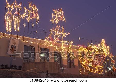 Stock Photography -  Christmas, Marietta, GA, Georgia, Atlanta, Lights of Life Christmas light display of Santa and Reindeer at Life College in Marietta. Fotosearch
