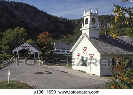 Stock Photo -  church, NH, New Hampshire, Stark, Stark Union Church and covered bridge in Stark Village in the fall.. Fotosearch
