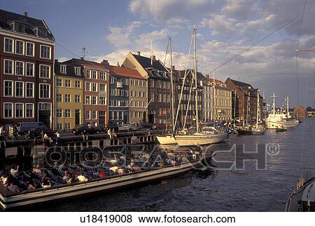 Copenhagen, canal, Denmark, Scandinavia, Sjaelland, Europe, Tour boat cruises Nyhavn (New Harbor) along the scenic city of Copenhagen View Large Photo Image Stock Photo - Copenhagen, canal, Denmark, Scandinavia, Sjaelland, Europe, Tour boat cruises Nyhavn (New Harbor) along the scenic city of Copenhagen. Fotosearch