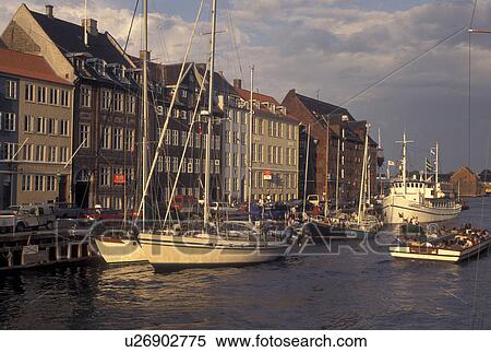 Copenhagen, canal, Denmark, Scandinavia, Sjaelland, Europe, Tour boat cruises Nyhavn (New Harbor) along the scenic city of Copenhagen View Large Photo Image Stock Photography - Copenhagen, canal, Denmark, Scandinavia, Sjaelland, Europe, Tour boat cruises Nyhavn (New Harbor) along the scenic city of Copenhagen. Fotosearch