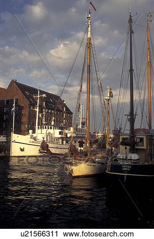Copenhagen, Denmark, canal, Scandinavia, Sjaelland, Europe, Boats docked along Nyhavn (New Harbor) in the scenic city of Copenhagen View Large Photo Image Stock Image - Copenhagen, Denmark, canal, Scandinavia, Sjaelland, Europe, Boats docked along Nyhavn (New Harbor) in the scenic city of Copenhagen. Fotosearch